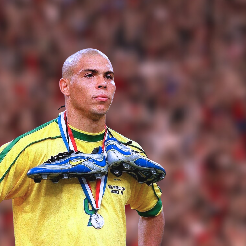 Ronaldo or "O Fenômeno", a retired Brazilian soccer player in yellow shirt shoes around neck